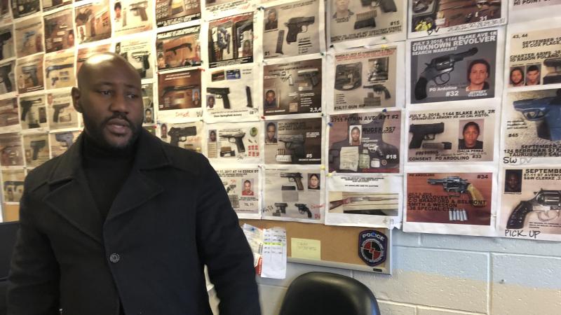 New York police Sgt. Damon Martin in the 75th Precinct field intelligence office, where the walls are covered with photos of seized illegal guns. New York police Sgt. Damon Martin in the 75th Precinct field intelligence office, where the walls are covered with photos of seized illegal guns.