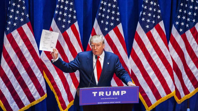 Donald Trump holds financial documents at his campaign announcement in June. He had said he didn't need donors because he could pay for his campaign himself, but he recently said he'd be open to people "investing" in his campaign. Donald Trump holds financial documents at his campaign announcement in June. He had said he didn't need donors because he could pay for his campaign himself, but he recently said he'd be open to people "investing" in his campaign.