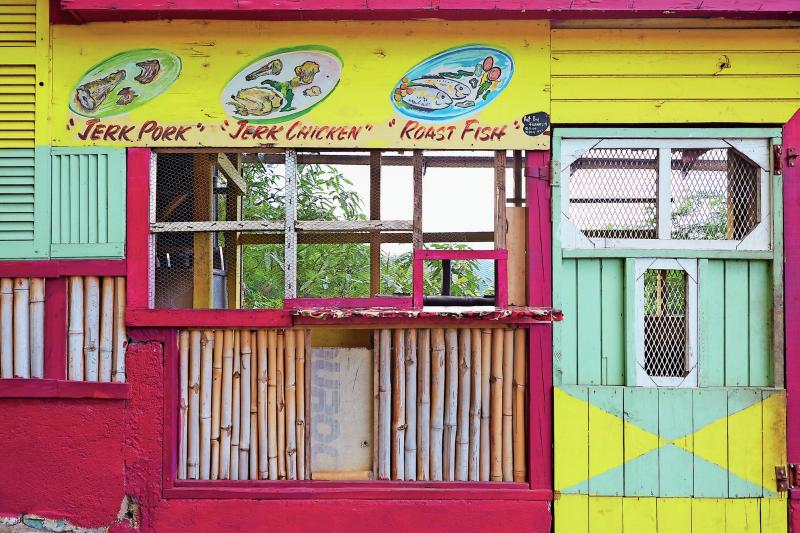 The pillars of Caribbean cuisine, framing the front of a streetside stall. The pillars of Caribbean cuisine, framing the front of a streetside stall.