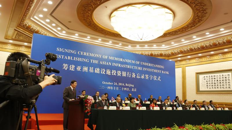 Chinese Finance Minister Lou Jiwei (left) speaks during the signing ceremony of the Asian Infrastructure Investment Bank last year in Beijing. Chinese Finance Minister Lou Jiwei (left) speaks during the signing ceremony of the Asian Infrastructure Investment Bank last year in Beijing.