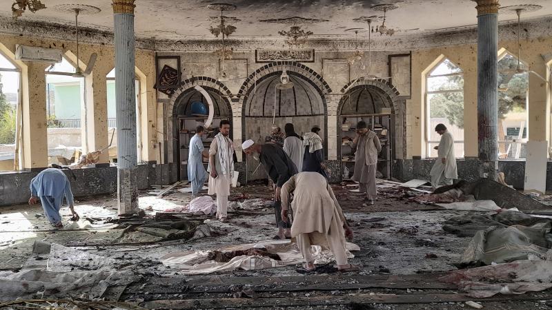 People sift through the damage inside of a mosque following a bombing in Kunduz province northern Afghanistan on Friday. People sift through the damage inside of a mosque following a bombing in Kunduz province northern Afghanistan on Friday.