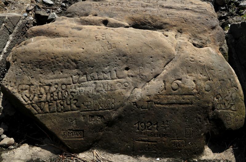 A "hunger stone" exposed by the low level of water in the Elbe River is seen in Decin, Czech Republic, on Thursday. The low level of water caused by the recent drought has exposed the stones on the riverbed. A "hunger stone" exposed by the low level of water in the Elbe River is seen in Decin, Czech Republic, on Thursday. The low level of water caused by the recent drought has exposed the stones on the riverbed.