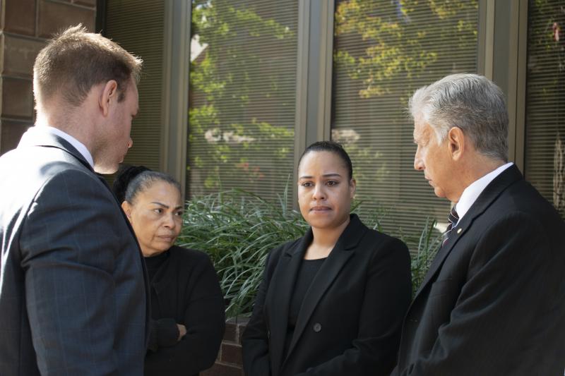 Rulennis Munoz (center right) outside Lancaster Courthouse Oct. 14, after learning that the police officer who fatally shot her brother had been cleared of criminal wrongdoing by the Lancaster County District Attorney. Her mother, Miguelina Peña, and her Rulennis Munoz (center right) outside Lancaster Courthouse Oct. 14, after learning that the police officer who fatally shot her brother had been cleared of criminal wrongdoing by the Lancaster County District Attorney. Her mother, Miguelina Peña, and her