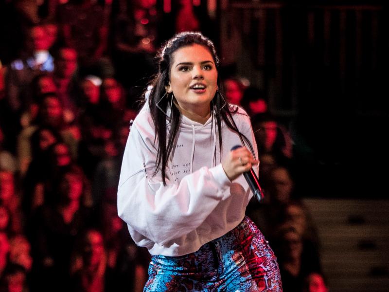 Dutch YouTube star turned model and singer Famke Louise performs on stage during a live show on television in the Netherlands. Famke Louise has come under fire recently for saying she would no longer participate in public campaigns to combat COVID-19. Dutch YouTube star turned model and singer Famke Louise performs on stage during a live show on television in the Netherlands. Famke Louise has come under fire recently for saying she would no longer participate in public campaigns to combat COVID-19.