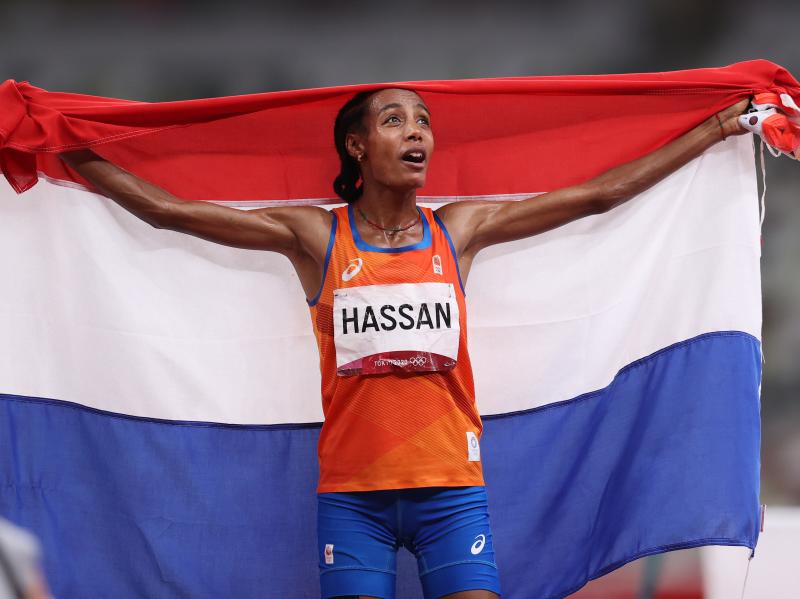 Sifan Hassan of Team Netherlands celebrates as she walks the track with her country's flag after winning the gold medal in the women's 5,000 meter final on Day 10 of the Tokyo Games. Sifan Hassan of Team Netherlands celebrates as she walks the track with her country's flag after winning the gold medal in the women's 5,000 meter final on Day 10 of the Tokyo Games.