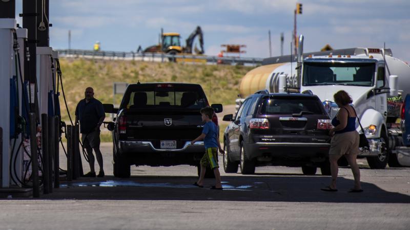 The CAFE standards that set fuel efficiency marks for the auto industry will be reopened for review, the Trump administration says. Here, vehicles refuel at a roadside gas station in New Mexico. The CAFE standards that set fuel efficiency marks for the auto industry will be reopened for review, the Trump administration says. Here, vehicles refuel at a roadside gas station in New Mexico.
