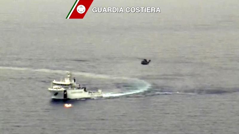 An Italian coast guard vessel took part in a large search and rescue operation Sunday after a boat carrying migrants capsized overnight. An Italian coast guard vessel took part in a large search and rescue operation Sunday after a boat carrying migrants capsized overnight.