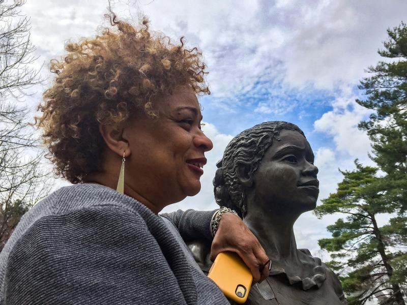 JerriAnne Boggis, executive director of the Black Heritage Trail of New Hampshire, poses with a monument that was erected in Harriet E. Wilson's honor. Boggis says when she read Wilson's book, she felt as if it was written the book just for her. JerriAnne Boggis, executive director of the Black Heritage Trail of New Hampshire, poses with a monument that was erected in Harriet E. Wilson's honor. Boggis says when she read Wilson's book, she felt as if it was written the book just for her.