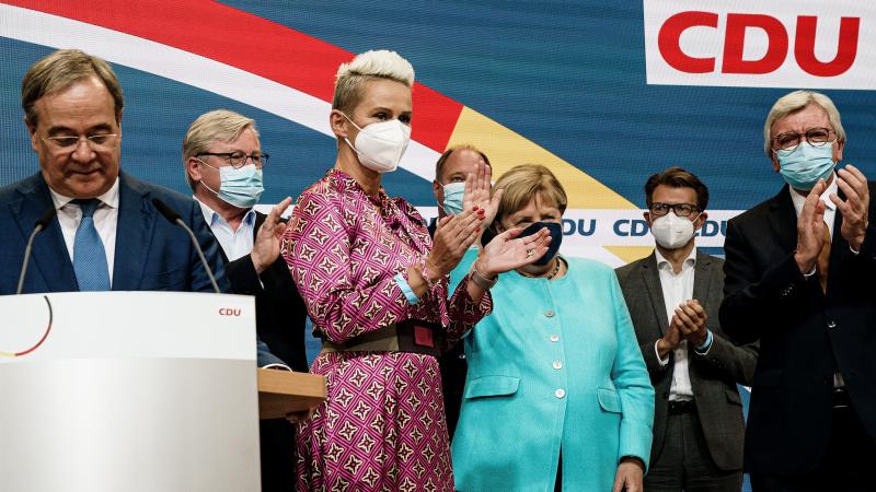 German Chancellor Angela Merkel receives applause during the Christian Democratic Union (CDU) election event on Sunday in Berlin. Voters have gone to the polls nationwide in elections that herald the end of Merkel's 16-year chancellorship. German Chancellor Angela Merkel receives applause during the Christian Democratic Union (CDU) election event on Sunday in Berlin. Voters have gone to the polls nationwide in elections that herald the end of Merkel's 16-year chancellorship.