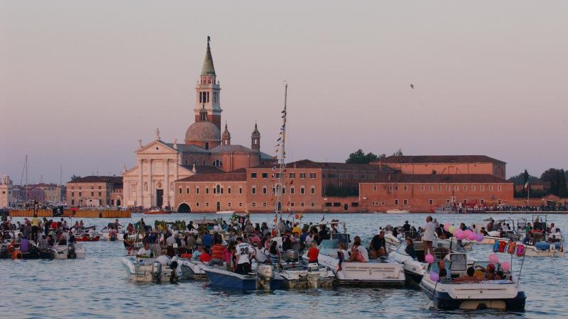 Venetians celebrate during the Festa del Redentore in Venice. The festival began in 1576 when the Republic's Senate voted to build a church on the Giudecca Island to Christ the Redeemer to thank God for the city's deliverance from the Plague. Venetians celebrate during the Festa del Redentore in Venice. The festival began in 1576 when the Republic's Senate voted to build a church on the Giudecca Island to Christ the Redeemer to thank God for the city's deliverance from the Plague.