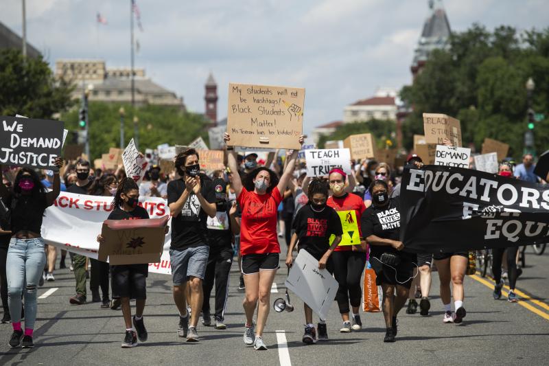 Black Students Matter demonstrators march en route to a rally at the Department of Education in Washington, D.C., on June 19. Black Students Matter demonstrators march en route to a rally at the Department of Education in Washington, D.C., on June 19.