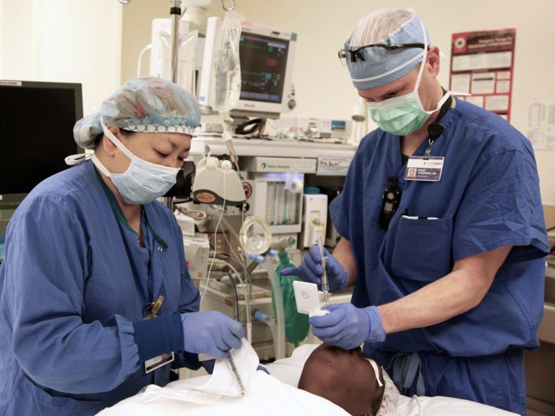 Dr. Brian Chesebro (right), in Portland, Ore., has calculated that by simply using the anesthesia gas sevoflurane in most surgeries, instead of the similar gas desflurane, he can significantly cut the amount of global warming each procedure contributes to Dr. Brian Chesebro (right), in Portland, Ore., has calculated that by simply using the anesthesia gas sevoflurane in most surgeries, instead of the similar gas desflurane, he can significantly cut the amount of global warming each procedure contributes to