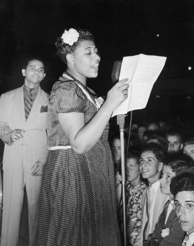 Ella Fitzgerald sings with bandleader Chick Webb in Asbury Park, N.J., in 1938. Ella Fitzgerald sings with bandleader Chick Webb in Asbury Park, N.J., in 1938.
