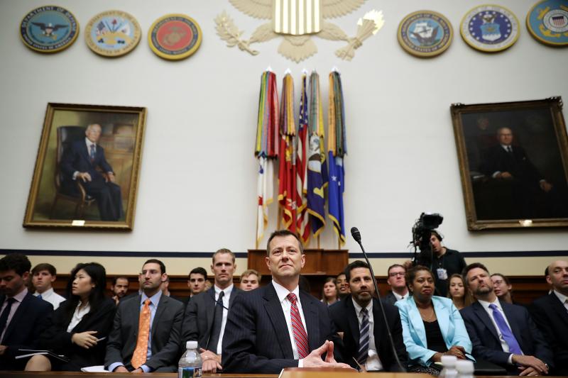 Deputy Assistant FBI Director Peter Strzok (center) waits to testify before a joint committee hearing of the House Judiciary and Oversight and Government Reform committees on Capitol Hill Thursday. Deputy Assistant FBI Director Peter Strzok (center) waits to testify before a joint committee hearing of the House Judiciary and Oversight and Government Reform committees on Capitol Hill Thursday.