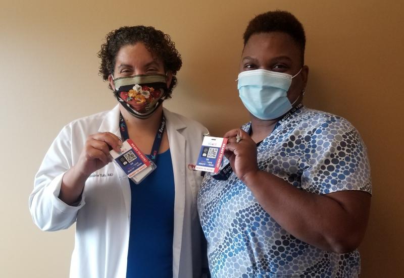 Dr. Madelaine Tully, left, and medical assistant Marshae Love hold up their VotER badges at Progressive Community Health Center in Milwaukee. VotER is an initiative to register new voters at ERs and clinics. Dr. Madelaine Tully, left, and medical assistant Marshae Love hold up their VotER badges at Progressive Community Health Center in Milwaukee. VotER is an initiative to register new voters at ERs and clinics.