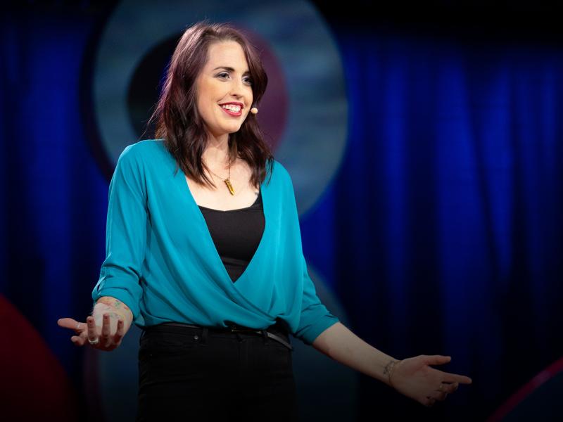 Emily Quinn speaks from the TED stage at TEDWomen 2018 Emily Quinn speaks from the TED stage at TEDWomen 2018