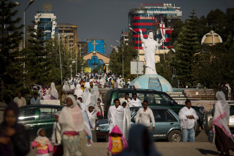 Worshippers stream through downtown Addis Ababa, Ethiopia, toward Bole Medhane Alem (Savior of the World) Cathedral, the largest Orthodox church in Africa. Worshippers stream through downtown Addis Ababa, Ethiopia, toward Bole Medhane Alem (Savior of the World) Cathedral, the largest Orthodox church in Africa.