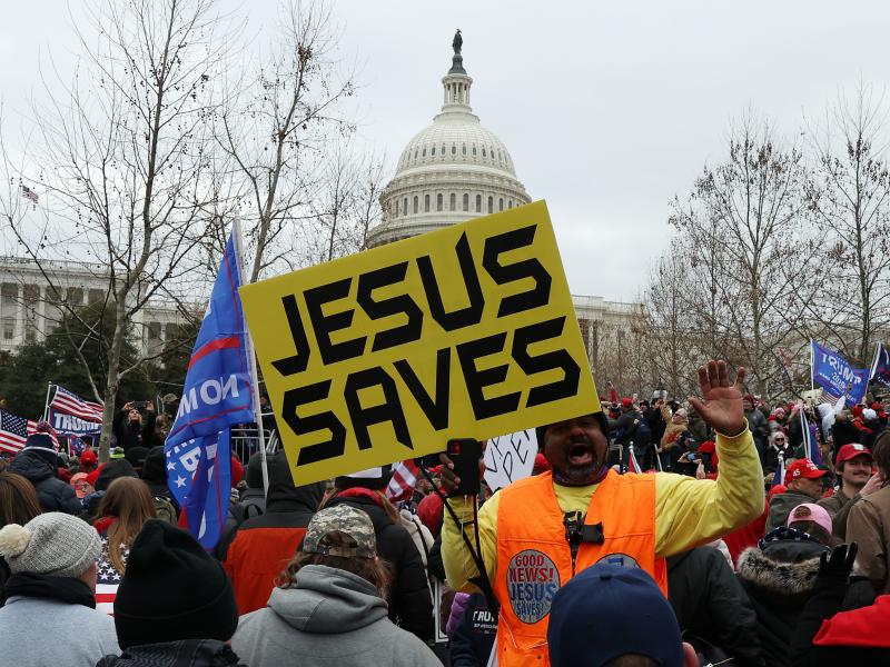 Protesters gather outside the U.S. Capitol on Jan. 6 in Washington, D.C., some with signs and symbols of Christianity. Pro-Trump protesters entered the U.S. Capitol that day after mass demonstrations in the nation's capital. Protesters gather outside the U.S. Capitol on Jan. 6 in Washington, D.C., some with signs and symbols of Christianity. Pro-Trump protesters entered the U.S. Capitol that day after mass demonstrations in the nation's capital.