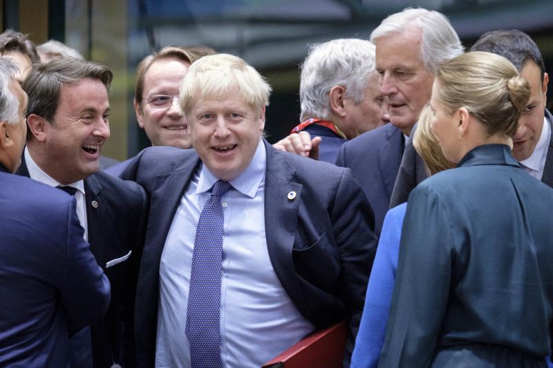 Luxembourg's Prime Minister Xavier Bettel (from left), U.K. Prime Minister Boris Johnson and the European Commission's chief Brexit negotiator, Michel Barnier, at the start of an EU summit on Thursday in Brussels. EU and British negotiators came to an agr Luxembourg's Prime Minister Xavier Bettel (from left), U.K. Prime Minister Boris Johnson and the European Commission's chief Brexit negotiator, Michel Barnier, at the start of an EU summit on Thursday in Brussels. EU and British negotiators came to an agr