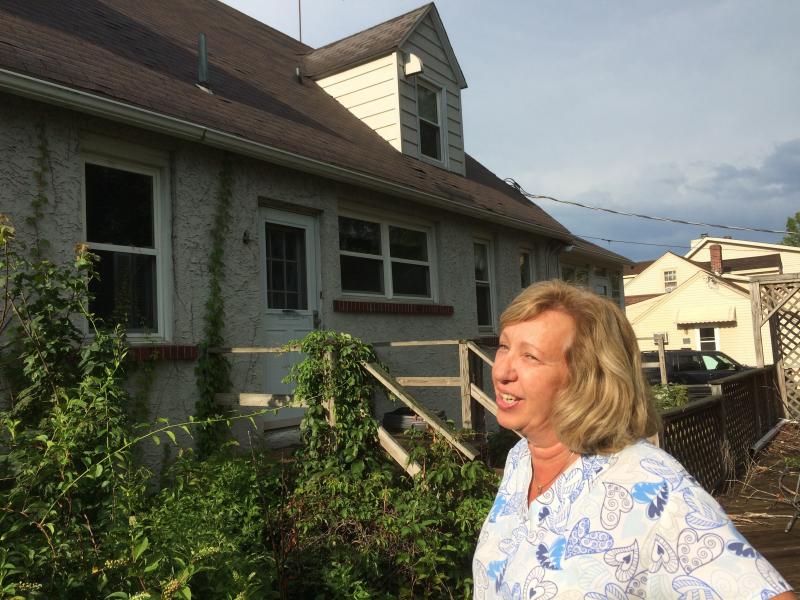 The house next door to Maureen and Michael McCabe has been sitting empty for seven years. "It freaks me out," Maureen McCabe says. "I don't know if there's animals running around there, mice and rodents." The house next door to Maureen and Michael McCabe has been sitting empty for seven years. "It freaks me out," Maureen McCabe says. "I don't know if there's animals running around there, mice and rodents."