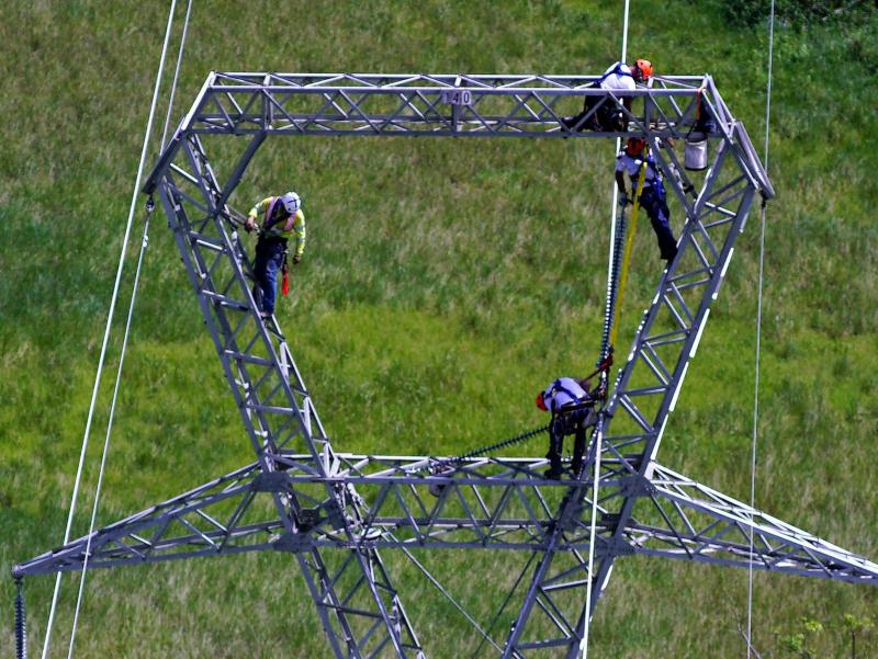 Whitefish Energy Holdings workers restore power lines damaged by Hurricane Maria in Barceloneta, Puerto Rico, on Wednesday. Whitefish Energy Holdings workers restore power lines damaged by Hurricane Maria in Barceloneta, Puerto Rico, on Wednesday.