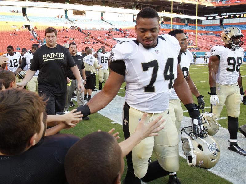 New Orleans Saints defensive end Glenn Foster Jr. greets fans before an NFL preseason game against Thursday, Aug. 29, 2013 in Miami Gardens, Fla. Foster died on Monday while in police custody. New Orleans Saints defensive end Glenn Foster Jr. greets fans before an NFL preseason game against Thursday, Aug. 29, 2013 in Miami Gardens, Fla. Foster died on Monday while in police custody.