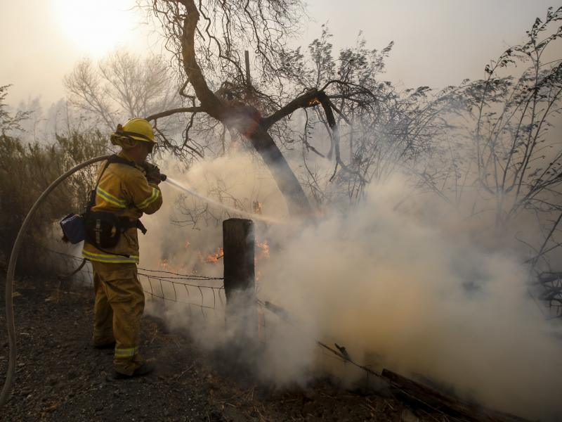 A firefighter battles a wildfire near a ranch in Simi Valley, Calif., on Wednesday. The large new wildfire erupted in wind-whipped Southern California, forcing the evacuation of the Ronald Reagan Presidential Library and nearby homes. A firefighter battles a wildfire near a ranch in Simi Valley, Calif., on Wednesday. The large new wildfire erupted in wind-whipped Southern California, forcing the evacuation of the Ronald Reagan Presidential Library and nearby homes.