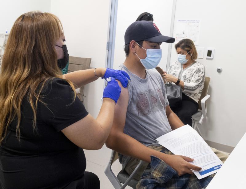 This 16-year-old got his Pfizer-BioNTech COVID-19 shot late last month at the UCI Health Family Health Center in Anaheim, Calif. Students as young as 12 are now eligible to get the vaccine, too, the FDA says. This 16-year-old got his Pfizer-BioNTech COVID-19 shot late last month at the UCI Health Family Health Center in Anaheim, Calif. Students as young as 12 are now eligible to get the vaccine, too, the FDA says.