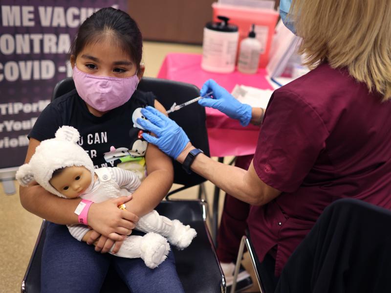 First grader Rihanna Chihuaque, 7, receives a COVID-19 vaccine at Arturo Velasquez Institute in Chicago last November. First grader Rihanna Chihuaque, 7, receives a COVID-19 vaccine at Arturo Velasquez Institute in Chicago last November.