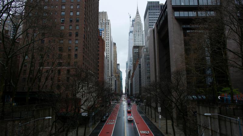 Cars cross 42th Street as rain falls on New York City. President Trump considered, and then dropped, a proposed quarantine of New York state, New Jersey and parts of Connecticut. Cars cross 42th Street as rain falls on New York City. President Trump considered, and then dropped, a proposed quarantine of New York state, New Jersey and parts of Connecticut.