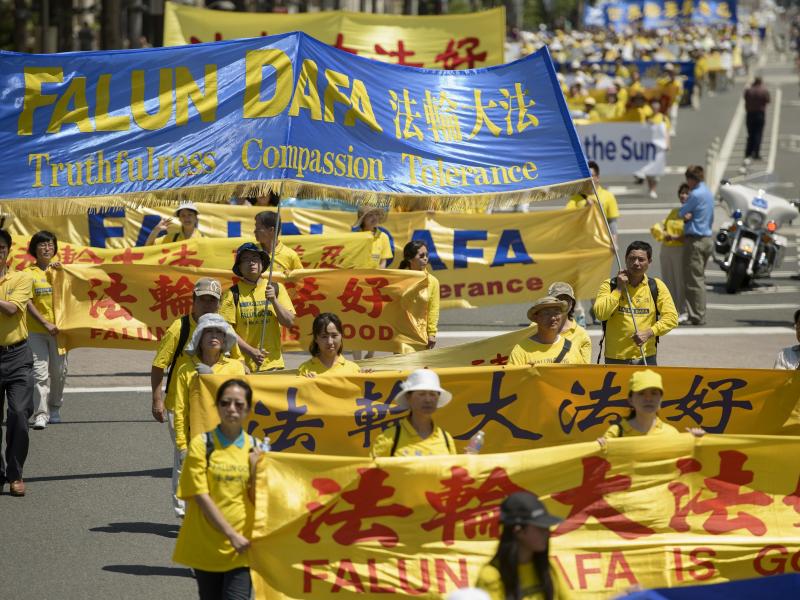 Falun Gong supporters marched from Capitol Hill to the Washington Monument in July 2015 in Washington, D.C. Falun Gong supporters marched from Capitol Hill to the Washington Monument in July 2015 in Washington, D.C.