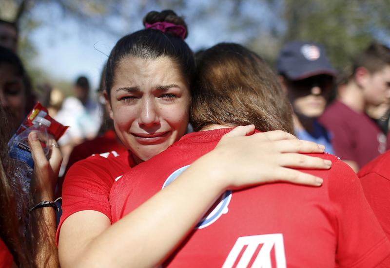 A student mourns the loss of her friend during a community vigil at Pine Trails Park on Feb. 15, 2018, in Parkland, Fla. A student mourns the loss of her friend during a community vigil at Pine Trails Park on Feb. 15, 2018, in Parkland, Fla.