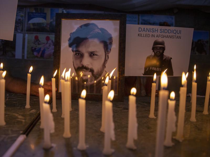 In this July 17, 2021, file photo, candles lit by journalists in New Delhi pay tribute to photojournalist Danish Siddiqui, who was killed in Afghanistan covering clashes between the Taliban and Afghan security forces. In this July 17, 2021, file photo, candles lit by journalists in New Delhi pay tribute to photojournalist Danish Siddiqui, who was killed in Afghanistan covering clashes between the Taliban and Afghan security forces.
