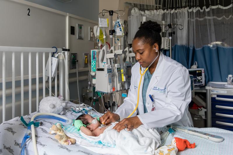 Nathaly Sweeney, a neonatologist at Rady Children's Hospital-San Diego and researcher with Rady Children's Institute for Genomic Medicine, attends to a young patient in the hospital's neonatal intensive care unit. Nathaly Sweeney, a neonatologist at Rady Children's Hospital-San Diego and researcher with Rady Children's Institute for Genomic Medicine, attends to a young patient in the hospital's neonatal intensive care unit.