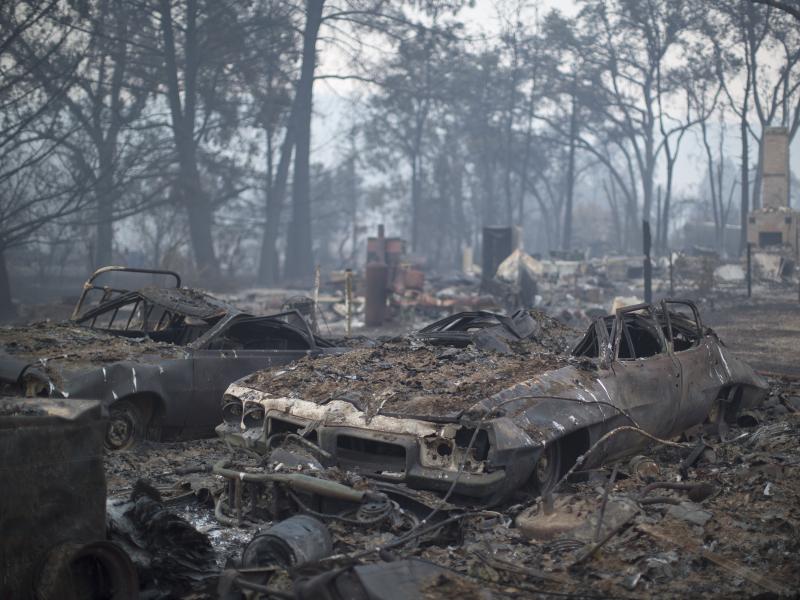 Cars and homes in Middletown, Calif., lay charred by the Valley Fire, which was 15 percent contained as of Tuesday afternoon. Cars and homes in Middletown, Calif., lay charred by the Valley Fire, which was 15 percent contained as of Tuesday afternoon.