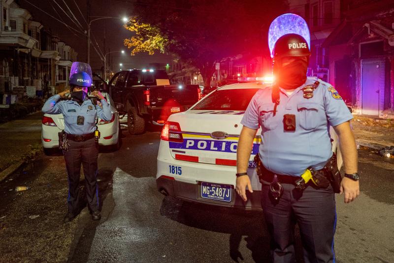 Police officers stand guard in Philadelphia following protests over the police shooting death of Walter Wallace on Tuesday. Police officers stand guard in Philadelphia following protests over the police shooting death of Walter Wallace on Tuesday.