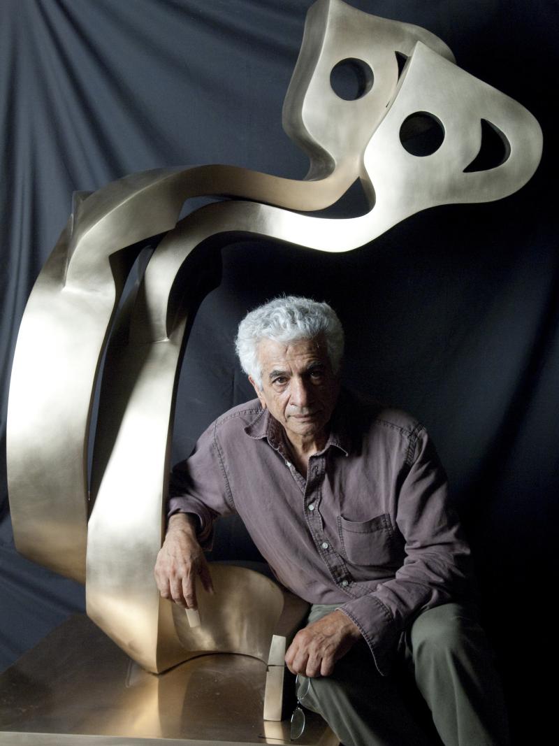 Artist Parviz Tanavoli with his sculpture Big Heech Lovers. Artist Parviz Tanavoli with his sculpture Big Heech Lovers.