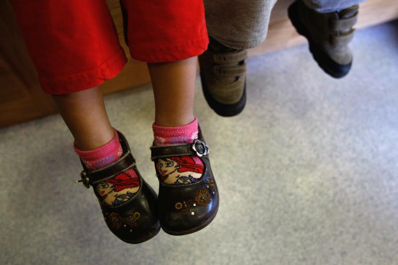 Children of Mexican immigrants wait to receive a free health checkup inside a mobile clinic at the Mexican Consulate in Denver, Colo., in 2009. The Trump administration wants to ratchet up scrutiny of the use of social services by immigrants. That's alrea Children of Mexican immigrants wait to receive a free health checkup inside a mobile clinic at the Mexican Consulate in Denver, Colo., in 2009. The Trump administration wants to ratchet up scrutiny of the use of social services by immigrants. That's alrea