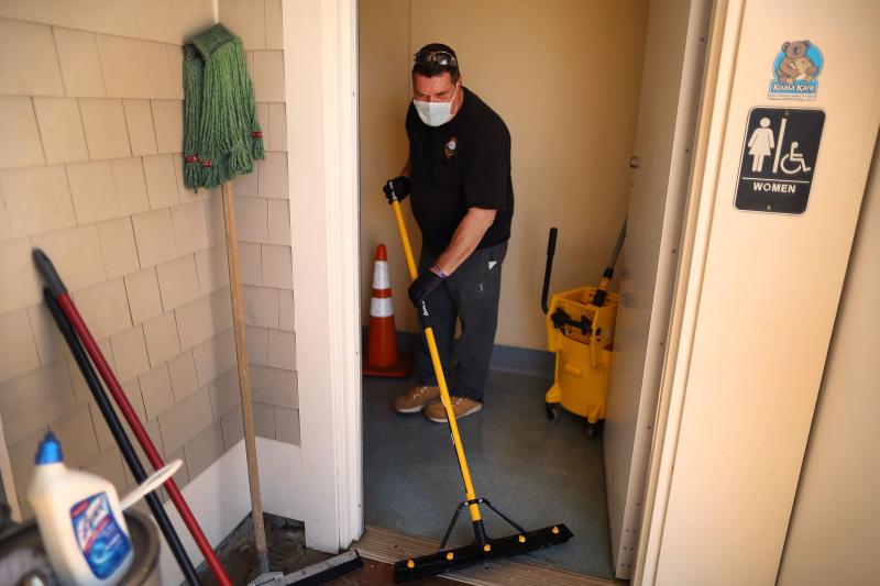 Town worker Steve Crowley washes and disinfects the public restroom at Mayflower Beach, in Dennis, Mass., last week. As stay-at-home restrictions are lifting, many people are concerned about using public restrooms. Town worker Steve Crowley washes and disinfects the public restroom at Mayflower Beach, in Dennis, Mass., last week. As stay-at-home restrictions are lifting, many people are concerned about using public restrooms.