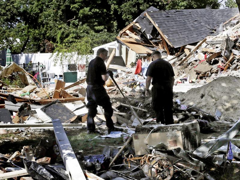 Fire investigators search the debris at a home where an explosion occurred following a gas line failure in September in Lawrence, Mass. Fire investigators search the debris at a home where an explosion occurred following a gas line failure in September in Lawrence, Mass.