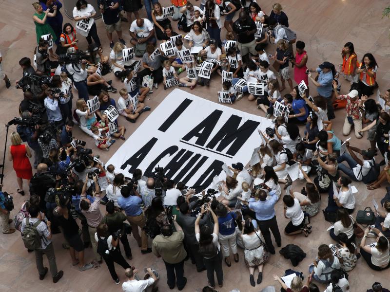 Families with young children protest the separation of immigrant families with a sit-in at the Hart Senate Office Building in Washington last week. Families with young children protest the separation of immigrant families with a sit-in at the Hart Senate Office Building in Washington last week.