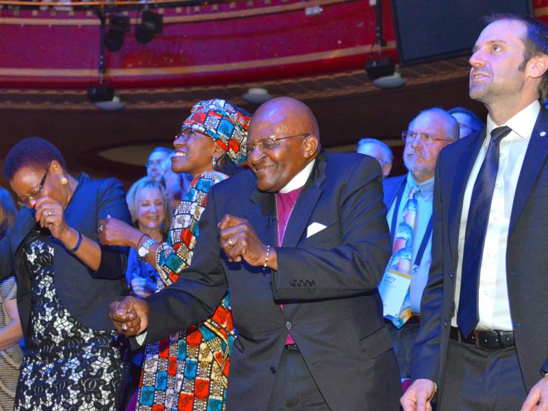 Archbishop Desmond Tutu and his daughter Mpho bust some moves at the 2015 Skoll World Forum. Archbishop Desmond Tutu and his daughter Mpho bust some moves at the 2015 Skoll World Forum.