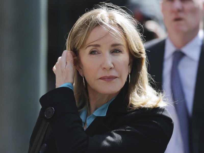 Federal prosecutors say that one coach and 13 parents, including actress Felicity Huffman, will plead guilty to fraud charges in the college admissions scandal. Huffman is seen here arriving at federal court in Boston last week. Federal prosecutors say that one coach and 13 parents, including actress Felicity Huffman, will plead guilty to fraud charges in the college admissions scandal. Huffman is seen here arriving at federal court in Boston last week.