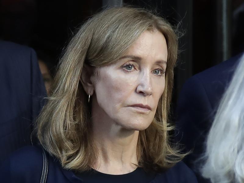 Actress Felicity Huffman leaves federal court after her sentencing in a nationwide college admissions bribery scandal in Boston last month. Actress Felicity Huffman leaves federal court after her sentencing in a nationwide college admissions bribery scandal in Boston last month.