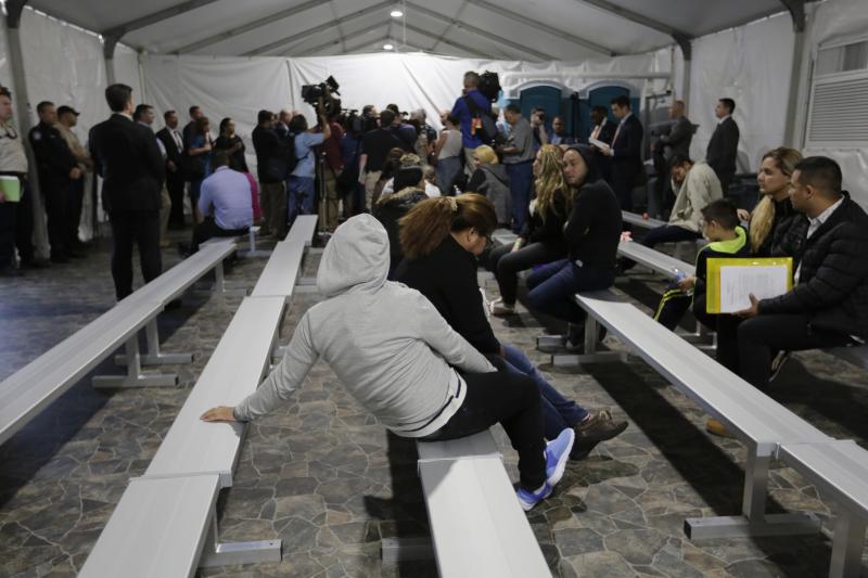 Migrants applying for asylum in the United States go through a processing area at a new tent courtroom at the Migration Protection Protocols Immigration Hearing Facility in Laredo, Texas, in September. Migrants applying for asylum in the United States go through a processing area at a new tent courtroom at the Migration Protection Protocols Immigration Hearing Facility in Laredo, Texas, in September.