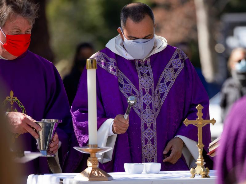 The Rev. Michael Amabisco blesses ashes during an Ash Wednesday service at St. Raymond Catholic Church in Menlo Park, Calif., in February. A new Gallup survey finds that those professing church membership has fallen 18 percentage points among Catholics si The Rev. Michael Amabisco blesses ashes during an Ash Wednesday service at St. Raymond Catholic Church in Menlo Park, Calif., in February. A new Gallup survey finds that those professing church membership has fallen 18 percentage points among Catholics si
