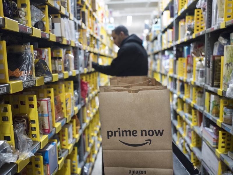 A clerk pick an item for a customer order at the Amazon Prime warehouse in New York. Amazon Empire director James Jacoby describes the pace of work within the company's warehouses as "incredibly grueling." A clerk pick an item for a customer order at the Amazon Prime warehouse in New York. Amazon Empire director James Jacoby describes the pace of work within the company's warehouses as "incredibly grueling."