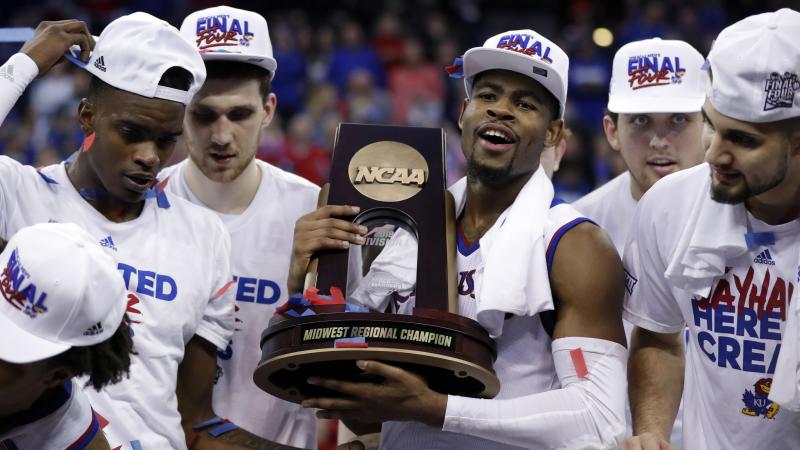 Kansas' Malik Newman holds the trophy after defeating Duke in a regional final game in the NCAA men's basketball tournament Sunday in Omaha, Neb. Kansas won 85-81 in overtime. Kansas' Malik Newman holds the trophy after defeating Duke in a regional final game in the NCAA men's basketball tournament Sunday in Omaha, Neb. Kansas won 85-81 in overtime.