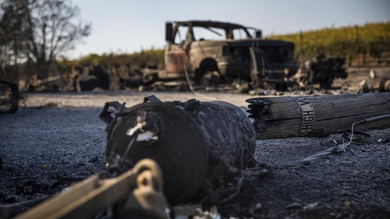 A PG&E utility pole rests on a burned-out property in Healdsburg, Calif., on Monday. The community was just one of many in Sonoma County affected by the Kincade Fire, which has swelled to a size much larger than San Francisco. A PG&E utility pole rests on a burned-out property in Healdsburg, Calif., on Monday. The community was just one of many in Sonoma County affected by the Kincade Fire, which has swelled to a size much larger than San Francisco.