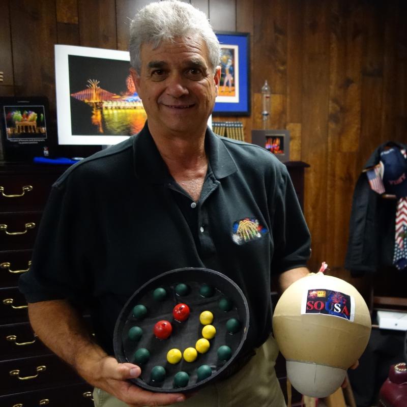 Jim Souza, president of Pyro Spectaculars, poses with samples of some of the fireworks he's planning for this year's Macy's show. Jim Souza, president of Pyro Spectaculars, poses with samples of some of the fireworks he's planning for this year's Macy's show.